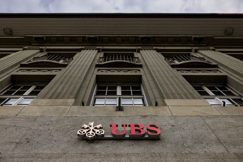 FILE PHOTO: The UBS logo is pictured on a building next to the Federal Palace of Switzerland, in Bern, Switzerland, December 11, 2025. REUTERS/Pierre Albouy/File Photo