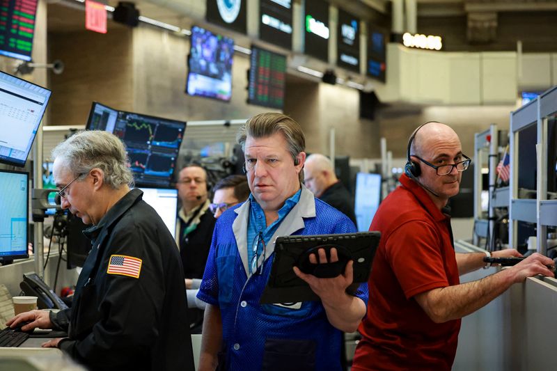 Futures-options traders work on the floor at the New York Stock Exchange's NYSE American (AMEX) in New York City, U.S., March 18, 2026.  REUTERS/Brendan McDermid