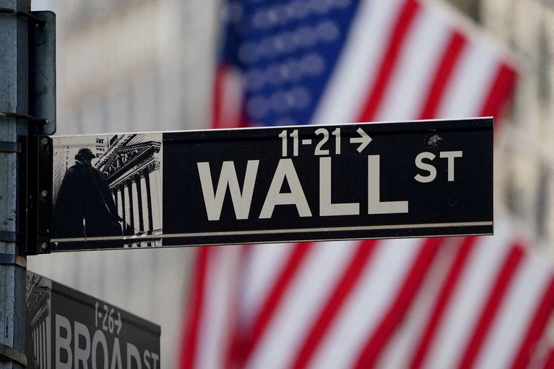 FILE PHOTO: The Wall Street sign is pictured at the New York Stock Exchange (NYSE) in the Manhattan borough of New York City, New York, U.S., March 9, 2020. REUTERS/Carlo Allegri/File Photo