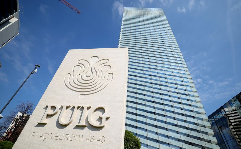 The logo of Spanish beauty group Puig is pictured at the entrance of its headquarters in Hospitalet de Llobregat, next to Barcelona, Spain March 24, 2026. REUTERS/ Albert Gea