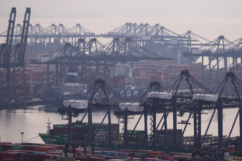 Cranes and cargo ships at a terminal of the Yantian port in Shenzhen, Guangdong province, China October 30, 2025. REUTERS/Tingshu Wang