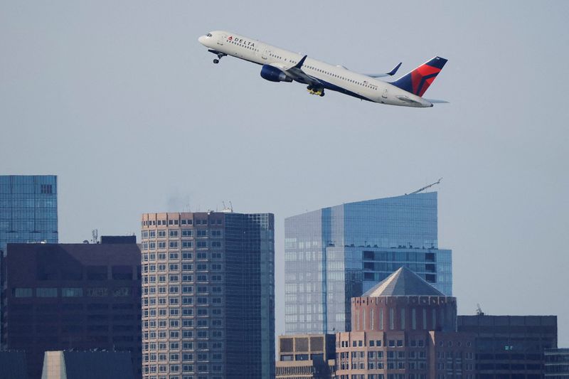FILE PHOTO: A Delta Airlines flight takes off from Logan International Airport, in Boston, Massachusetts, U.S., November 7, 2025.   REUTERS/Brian Snyder/File Photo