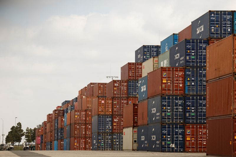 Shipping containers are stacked at the port of Los Angeles in Long Beach, California, U.S., March 10, 2026. REUTERS/Caroline Brehman