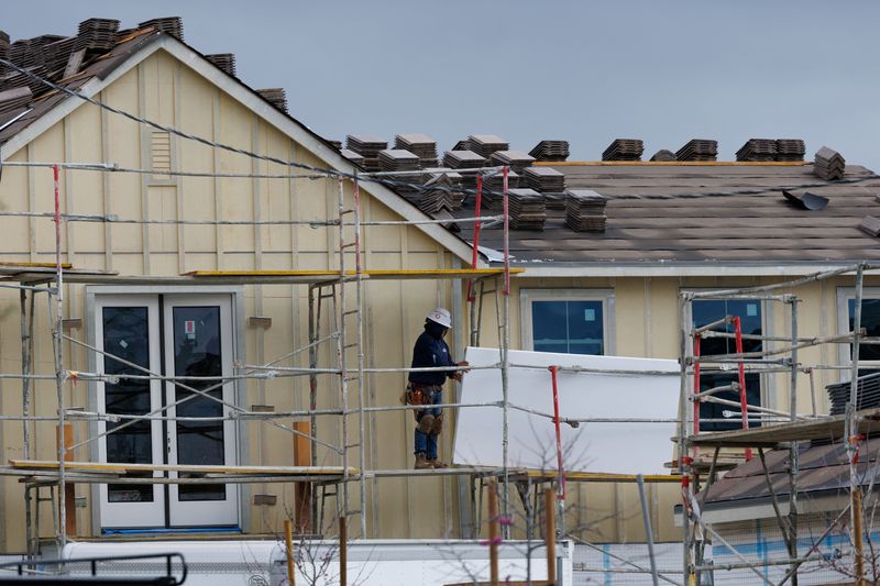 Workers construct a single family home at a Lennar housing development in San Diego, California, U.S., March 11, 2025.  REUTERS/Mike Blake