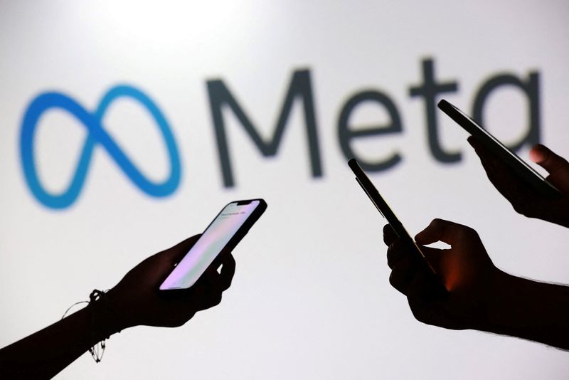 Teenagers pose for a photo while holding smartphones in front of a Meta logo in this illustration taken September 11, 2025. REUTERS/Dado Ruvic/Illustration