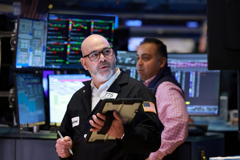 Traders work on the floor at the New York Stock Exchange (NYSE) in New York City, U.S., March 18, 2026.  REUTERS/Brendan McDermid