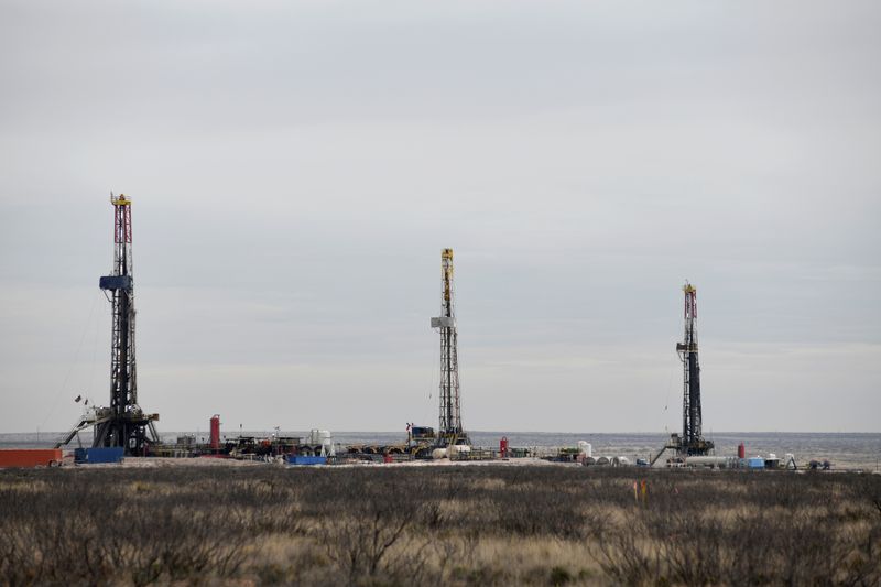 Drilling rigs operate in the Permian Basin oil and natural gas production area in Lea County, New Mexico, U.S., February 10, 2019. Picture taken February 10, 2019.    REUTERS/Nick Oxford/File Photo