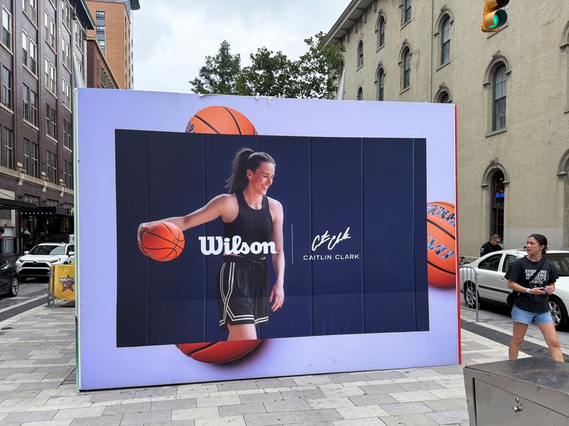An advertisement featuring Caitlin Clark is displayed ahead of the WNBA All-Star Game, in Indianapolis, Indiana, July 19, 2025. REUTERS/Amy Tennery