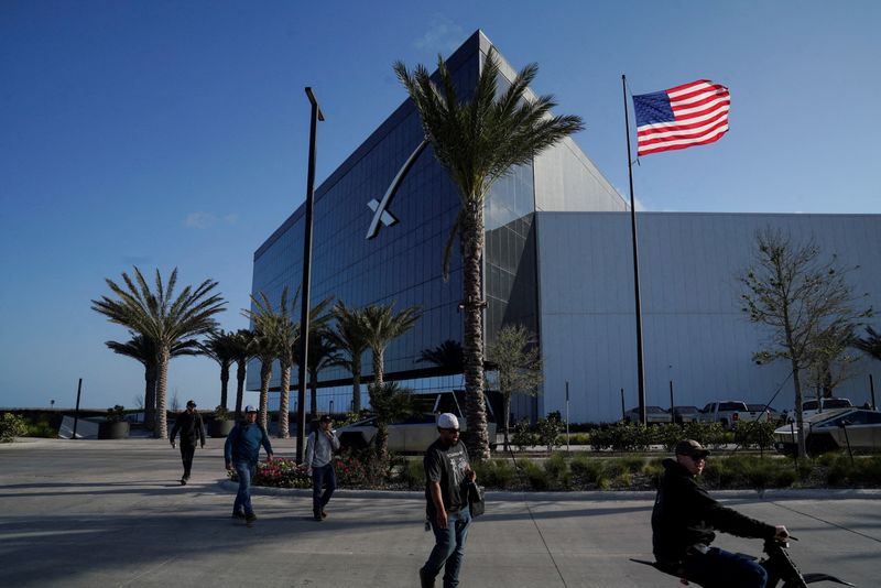 FILE PHOTO: SpaceX’s facilities and employees, as speculation mounts on when the company will aim to file its initial public offering (IPO) prospectus with regulators in Starbase, Texas, U.S. March 25, 2026.  REUTERS/Gabriel V. Cardenas/File Photo