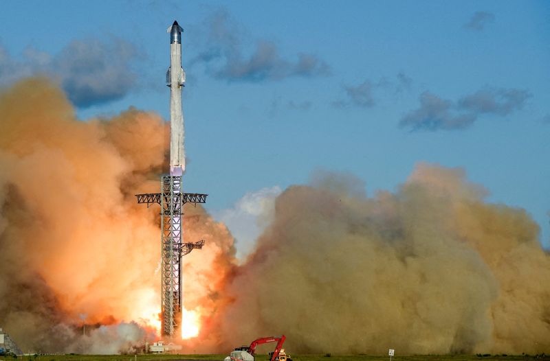 FILE PHOTO: A SpaceX Super Heavy booster carrying the Starship spacecraft lifts off on its 11th test flight at the company's launch pad in Starbase, Texas, U.S., October 13, 2025. REUTERS/Steve Nesius/File Photo