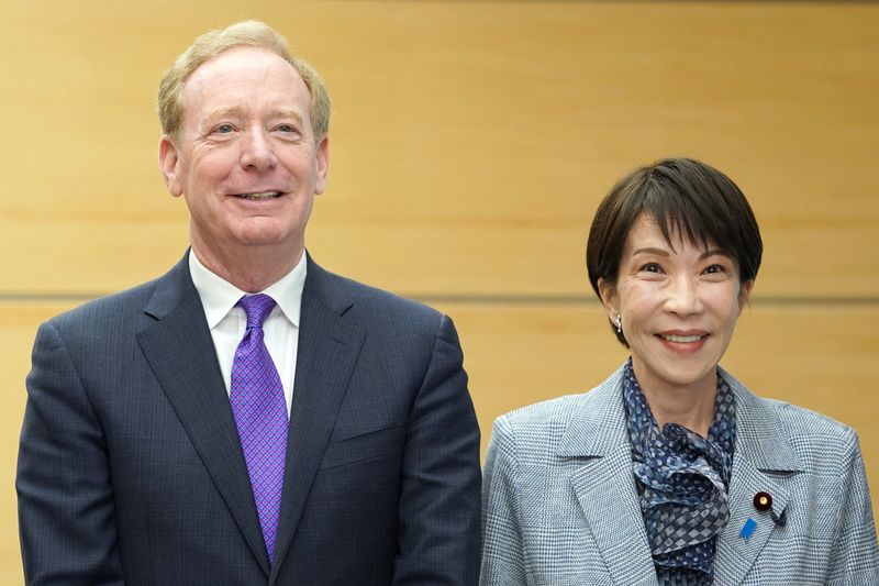 Microsoft's Vice Chair and President Brad Smith and Japan's Prime Minister Sanae Takaichi pose before their meeting at the Prime Minister's Office in Tokyo, Japan April 3, 2026.     KAZUHIRO NOGI/Pool via REUTERS