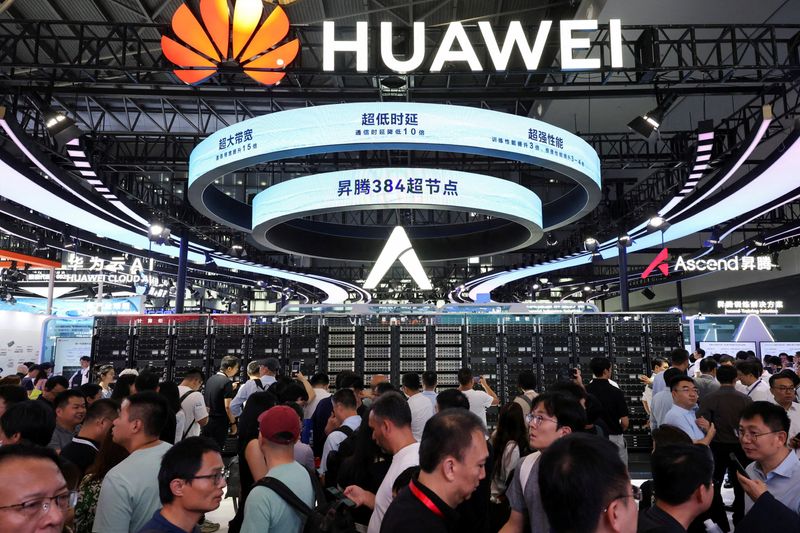FILE PHOTO: People visit a Huawei booth during the World Artificial Intelligence Conference in Shanghai, China July 26, 2025.  REUTERS/Go Nakamura/File Photo
