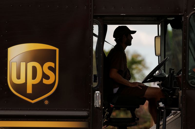 FILE PHOTO: A UPS delivery van is driven long a city street in Garden Grove, California, U.S., March 29, 2022. REUTERS/Mike Blake/File Photo