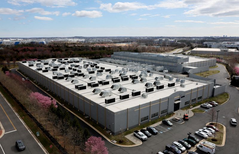A car drives past a building of the Digital Realty Data Center in Ashburn, Virginia, U.S., March 17, 2025. REUTERS/Leah Millis