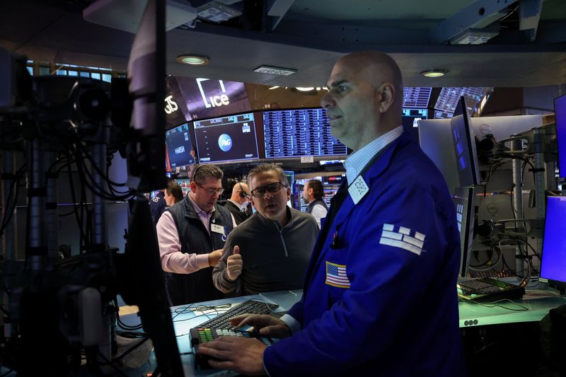 Traders work on the floor at the New York Stock Exchange (NYSE) in New York City, U.S., April 8, 2026. REUTERS/Brendan McDermid