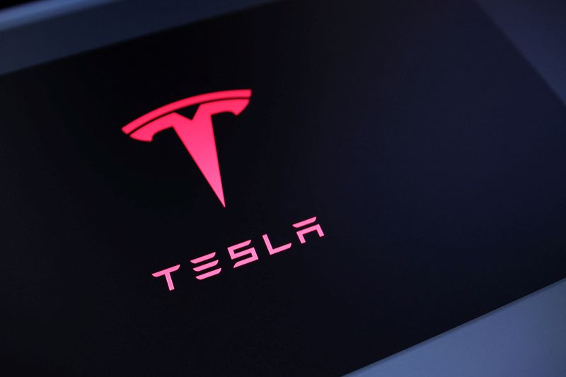 Tesla logo is seen in this illustration taken July 23, 2025. REUTERS/Dado Ruvic/Illustration