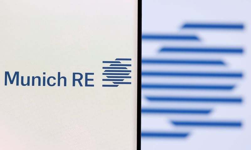 Munich Re Group logo is seen on a smartphone in front of displayed same logo in this illustration taken, December 1, 2021. REUTERS/Dado Ruvic/Illustration