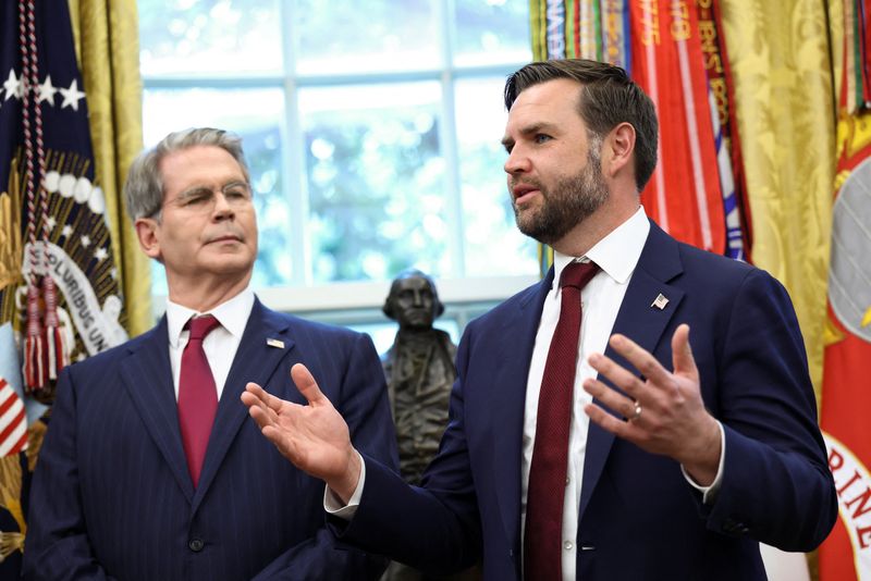 U.S. Vice President JD Vance speaks next to U.S. Treasury Secretary Scott Bessent at the White House in Washington, D.C., U.S., September 25, 2025. REUTERS/Kevin Lamarque