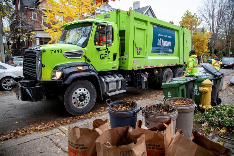 FILE PHOTO: A truck from Canadian waste management company GFL Environmental Inc makes its rounds through a neighbourhood in Toronto, Ontario, Canada November 5, 2019. REUTERS/Carlos Osorio/File Photo