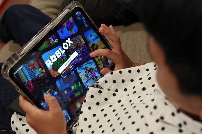 A child uses an iPad to play Roblox in Jakarta, Indonesia, March 12, 2026. REUTERS/Ajeng Dinar Ulfiana/File Photo