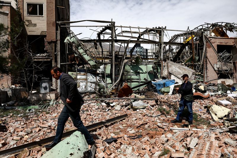 People inspect the damage at the research building of the Shahid Beheshti University, which was damaged by a strike, amid the U.S.-Israeli conflict with Iran, in Tehran, Iran, April 4, 2026. Majid Asgaripour/WANA (West Asia News Agency) via REUTERS