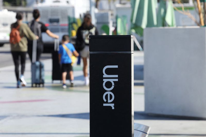 Uber signage is posted at Los Angeles International Airport (LAX) in Los Angeles, California, U.S. July 10, 2022.  REUTERS/David Swanson