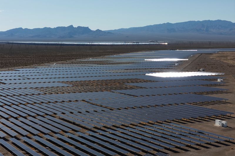 FILE PHOTO: A drone view of sunlight reflecting off solar panels at the Boulder Solar 1 facility in Boulder City, Nevada, U.S., November 23, 2025. REUTERS/Daniel Cole/File Photo