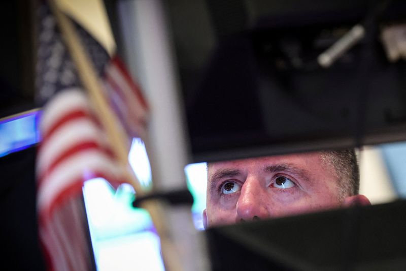 A trader works on the floor at the New York Stock Exchange (NYSE) in New York City, U.S., April 13, 2026.  REUTERS/Brendan McDermid