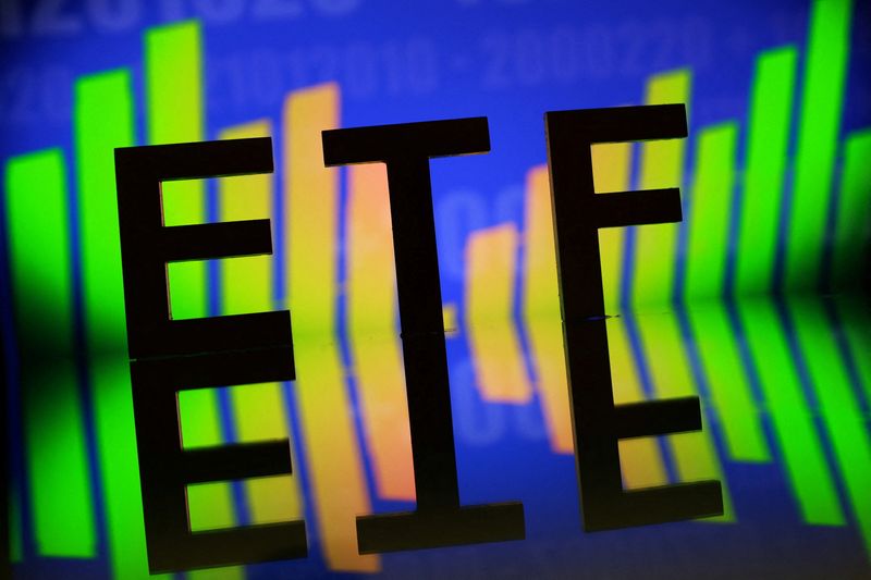 A 3D printed word "ETF (Exchange-Traded Fund)" is seen in front of stock graph in this illustration taken October 16, 2025. REUTERS/Dado Ruvic/Illustration/File Photo