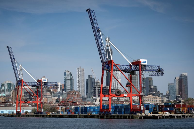 Shipping containers are stacked on a pier at the Red Hook Terminal in Brooklyn, New York City, U.S., April 14, 2026. REUTERS/Brendan McDermid