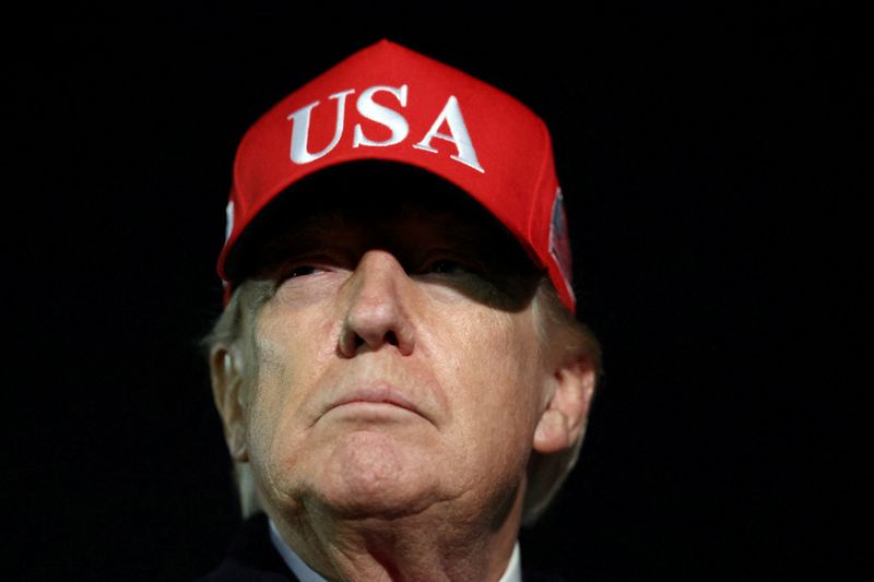 U.S. President Donald Trump looks on after disembarking Air Force One as he arrives at Joint Base Andrews in Maryland, U.S., April 12, 2026.  REUTERS/Kevin Lamarque