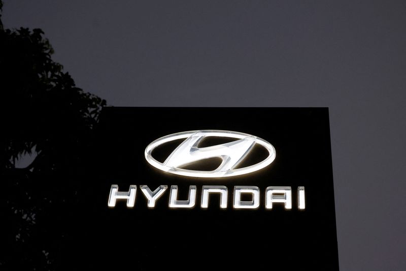 FILE PHOTO: The Logo of Hyundai Motor India Limited is seen outside a car showroom, in Ahmedabad, India, October 7, 2024. REUTERS/Amit Dave/File Photo