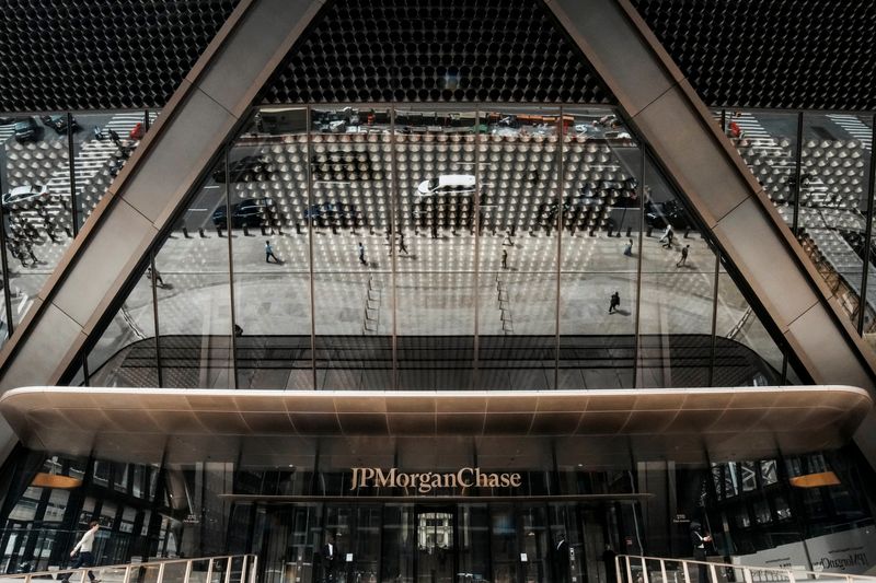 People pass by one of the entrances of the JPMorgan Chase & Co., headquarters in New York City, U.S., April 1, 2026. REUTERS/Eduardo Munoz