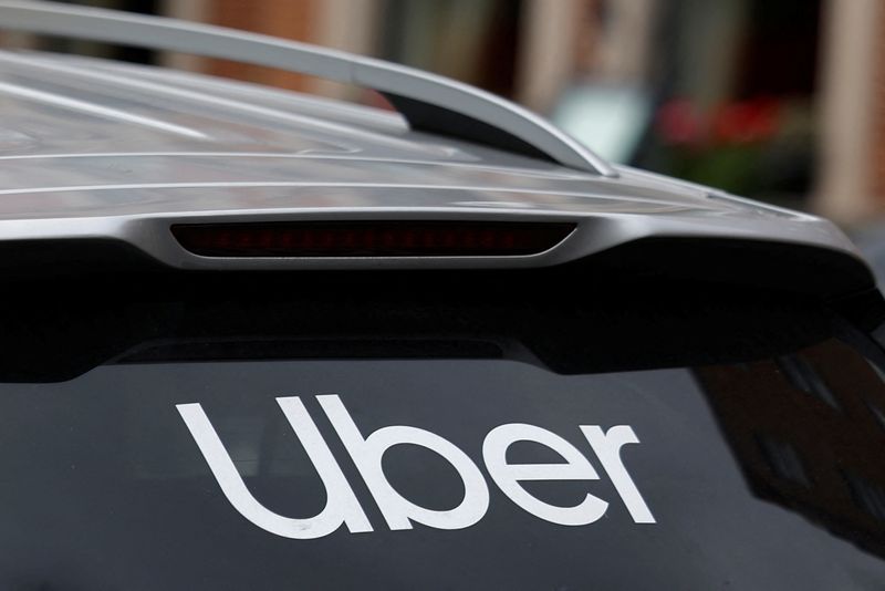 The Uber logo is seen on the rear window of a taxi, in Dublin, Ireland, June 29, 2025. REUTERS/Clodagh Kilcoyne