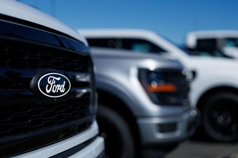 FILE PHOTO: Ford F-150 pickup trucks for sale in Encinitas, California, U.S. October 20, 2025. REUTERS/Mike Blake/File Photo