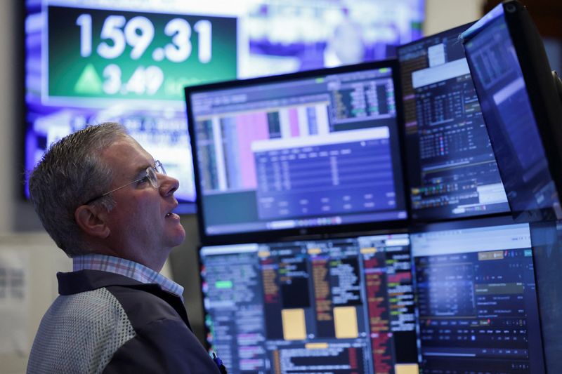 A trader works on the floor at the New York Stock Exchange (NYSE) in New York City, U.S., April 16, 2026. REUTERS/Jeenah Moon
