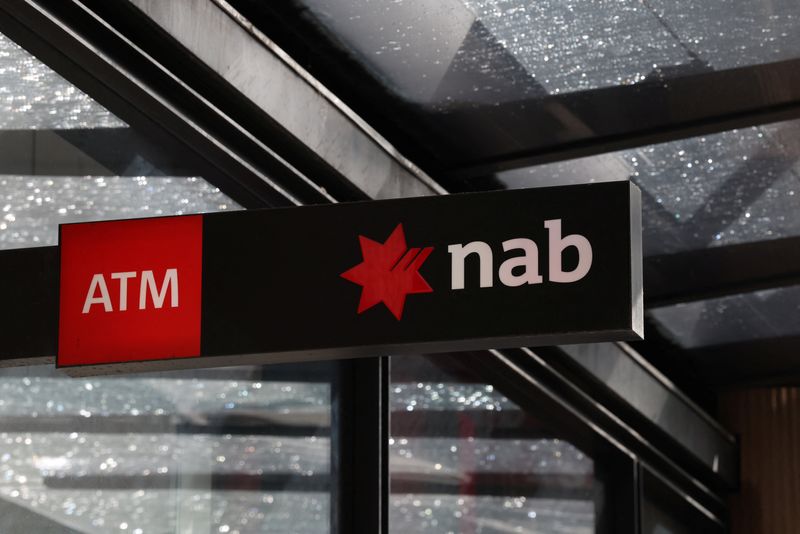 A National Australia Bank (NAB) logo is displayed above a NAB branch in the Central Business District (CBD), Sydney, Australia, August 19, 2025. REUTERS/Hollie Adams