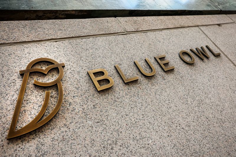 A logo for Blue Owl Capital is displayed on a midtown Manhattan office building in New York City, U.S., February 24, 2026.  REUTERS/Brendan McDermid