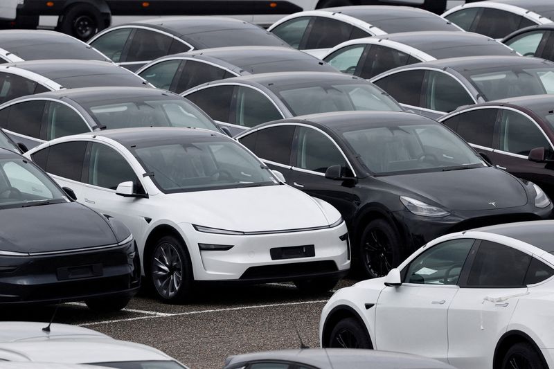 FILE PHOTO: Tesla electric vehicles are pictured at one of the company's delivery centers in Valenton, near Paris, France, April 24, 2025. REUTERS/Benoit Tessier/File Photo