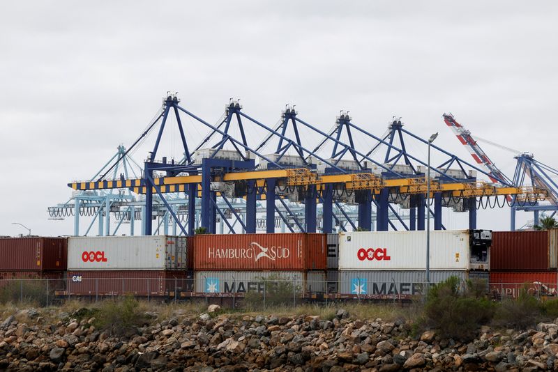 FILE PHOTO: Shipping containers wait to be transported along a railroad at the port of Los Angeles in Long Beach, California, U.S., March 10, 2026. REUTERS/Caroline Brehman/File Photo