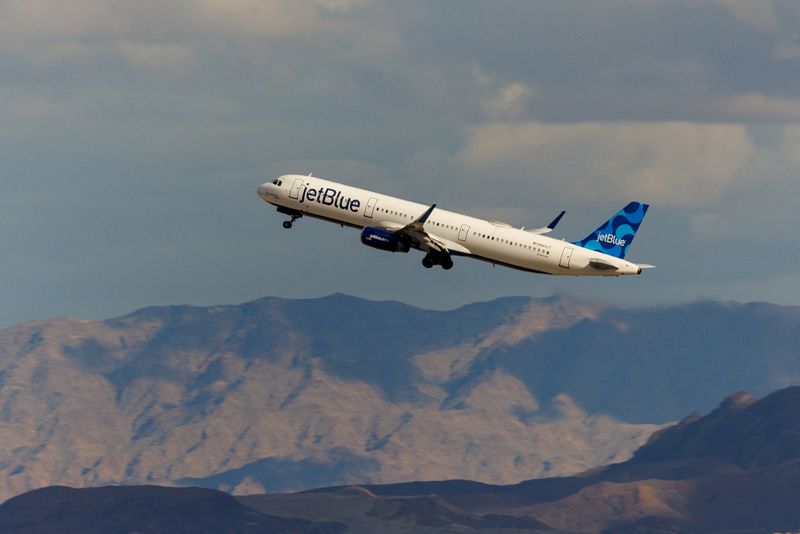 FILE PHOTO: A Jetblue commercial airliner takes off form Las Vegas International Airport in Las Vegas, Nevada, U.S., February 8, 2024.  REUTERS/Mike Blake/File Photo