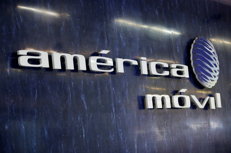 The logo of America Movil is pictured on the wall at a reception area in the company's corporate offices, in Mexico City, Mexico January 25, 2022. REUTERS/Gustavo Graf