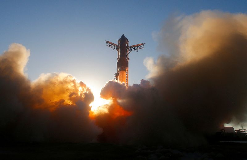 FILE PHOTO: A SpaceX Super Heavy booster carrying the Starship spacecraft lifts off on its 11th test flight at the company's launch pad in Starbase, Texas, U.S., October 13, 2025. REUTERS/Steve Nesius/File Photo