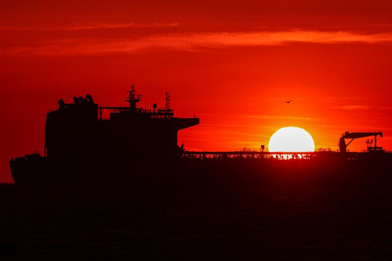 An oil tanker anchors near the oil hub of the port of Fos-Lavera at sunset near Marseille, southern France, April 14, 2026. REUTERS/Manon Cruz