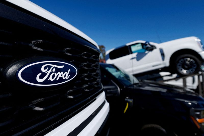 FILE PHOTO: A Ford logo on a Ford F-150 pickup truck for sale in Encinitas, California, U.S. October 20, 2025. REUTERS/Mike Blake//File Photo