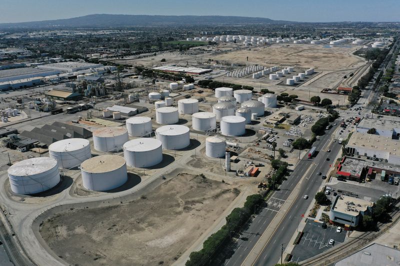 An aerial view of storage tanks at the Kinder Morgan Watson Station, a gathering system for oil and refined petroleum product pipelines, in Long Beach, California, U.S., March 11, 2022. REUTERS/Bing Guan
