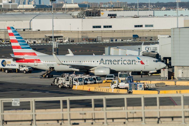 An American Airlines airplane is seen at John F. Kennedy International Airport in Queens, New York City, U.S., December 26, 2021. REUTERS/Jeenah Moon