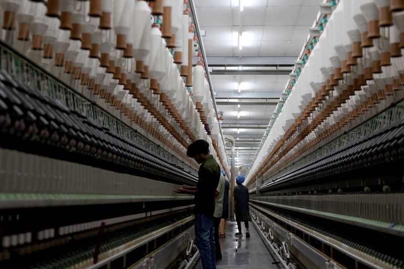 Employees work inside Fiotex Cotspin cotton yarn manufacturing factory at Rajkot, Gujarat, India, April 14, 2026. REUTERS/Amit Dave