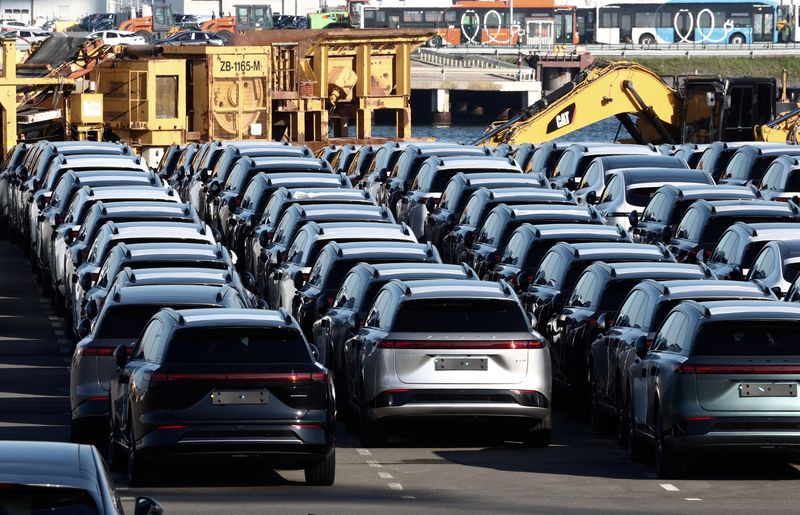 New China-built electric vehicles of the company Xpeng are seen parked in the port of Zeebrugge, Belgium, October 24, 2024. REUTERS/Yves Herman