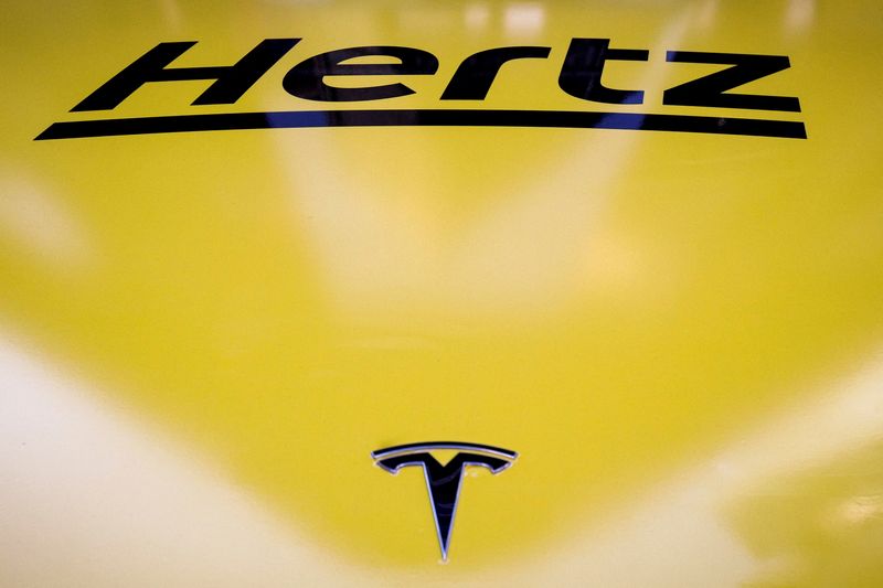 FILE PHOTO: A Hertz Tesla electric vehicle is displayed during the Hertz Corporation IPO at the Nasdaq Market site in Times Square in New York City, U.S., November 9, 2021. REUTERS/Brendan McDermid/File Photo